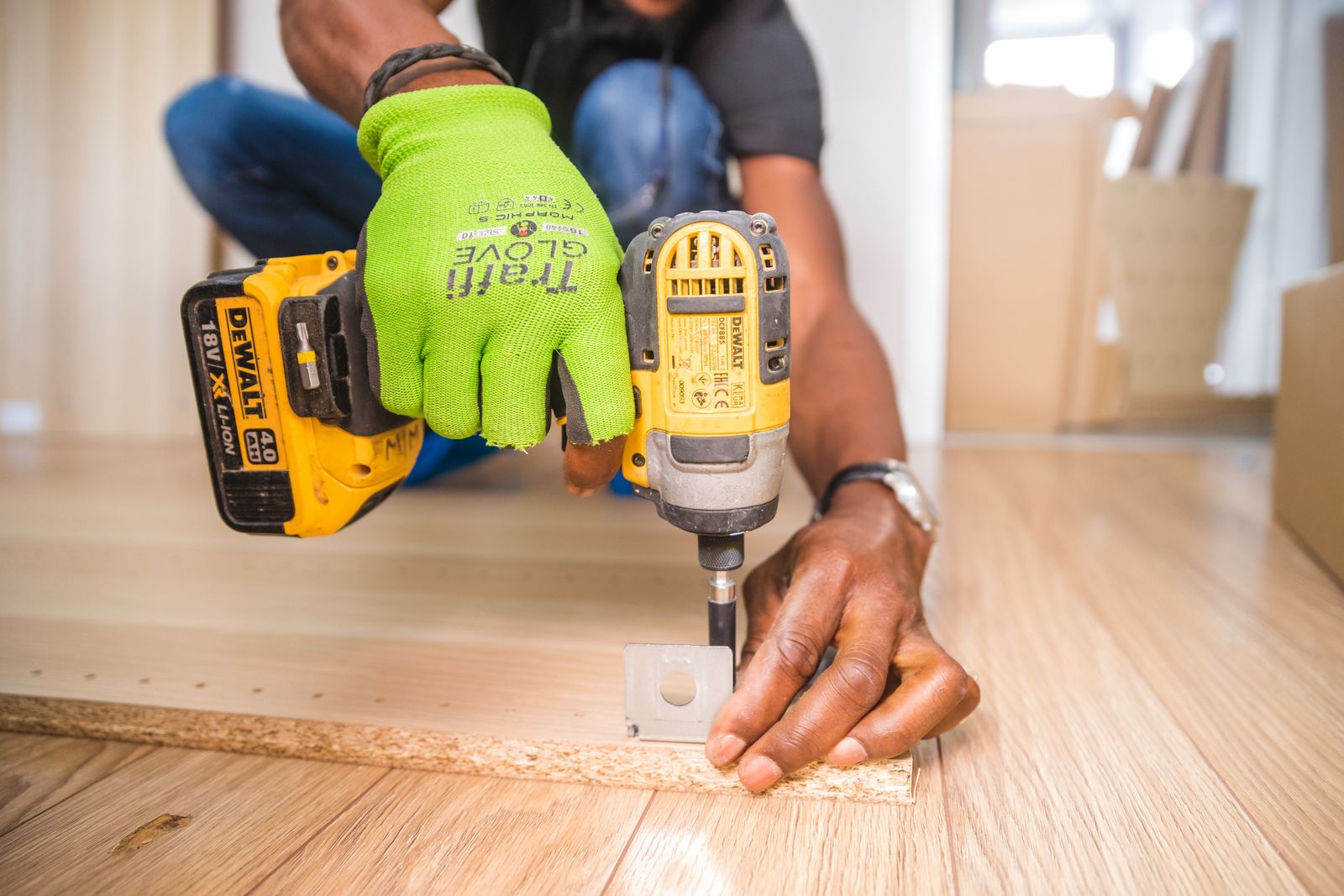 Finish carpenter installing hardwood flooring